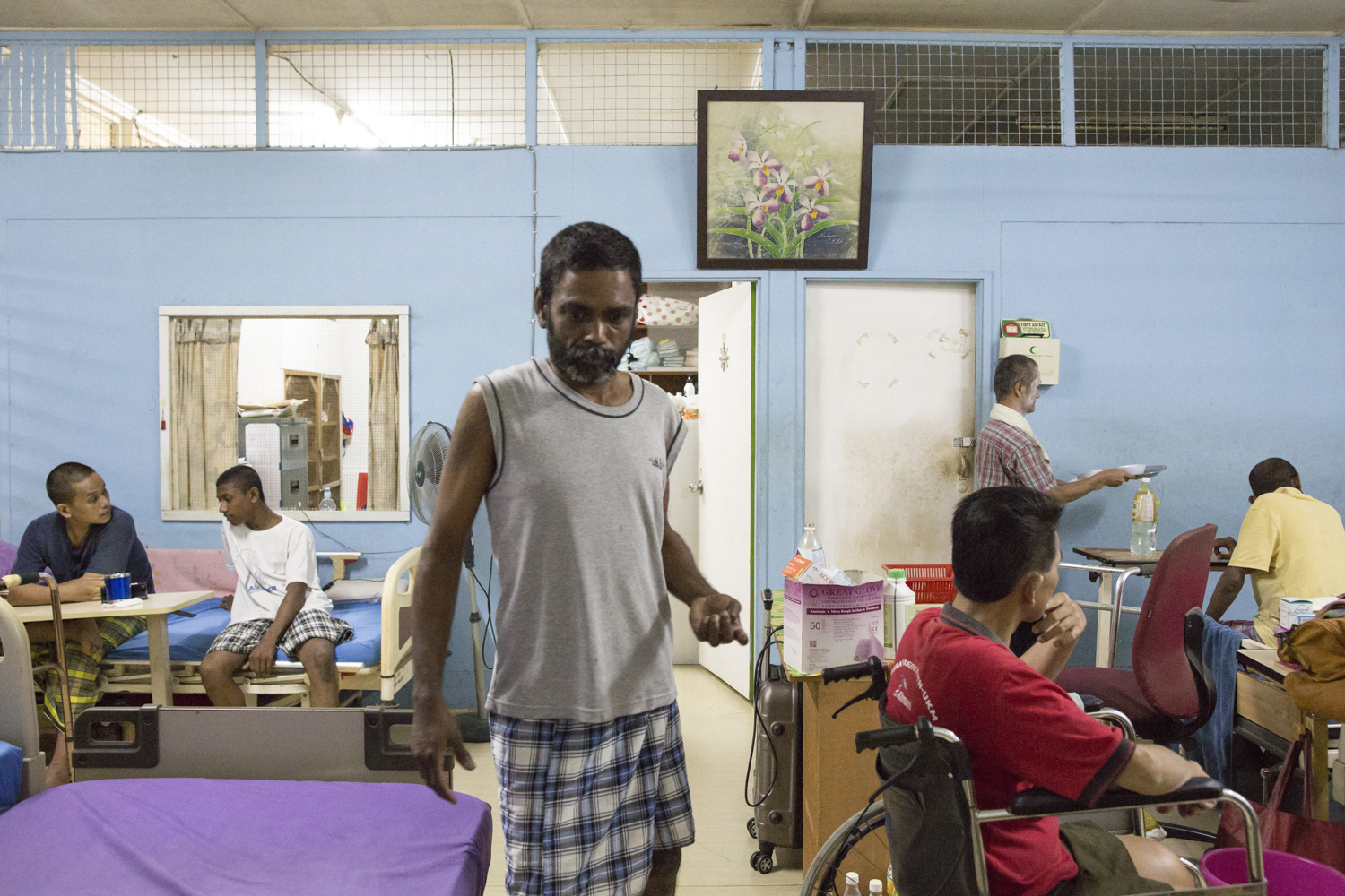 A typical scene in the evening at the sick bay. Kumaran used to work in a law firm before being diagnosed with HIV. He moved to PLC’s sick bay where he receives nursing care after developing a stroke.