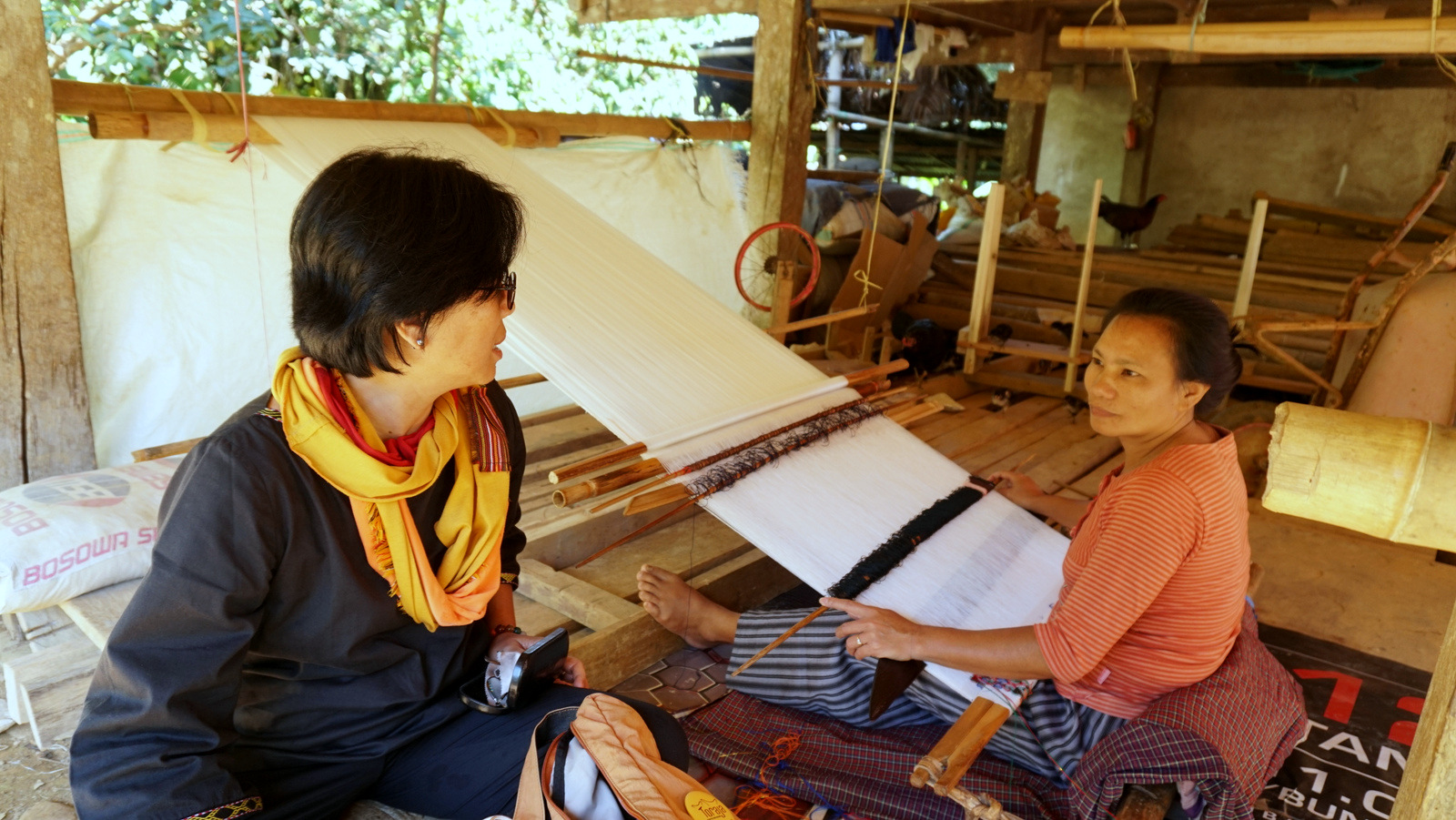 Dinny Yusuf, the founder of social enterprise Torajamelo, chats with Meri, who leads the weavers’ collective set up by Torajamelo to bring their craft to a larger market. In 2018, Torajamelo began offering tourism experiences officially, working together with the local community to do so sustainably. Photo by Upneet Kaur-Nagpal