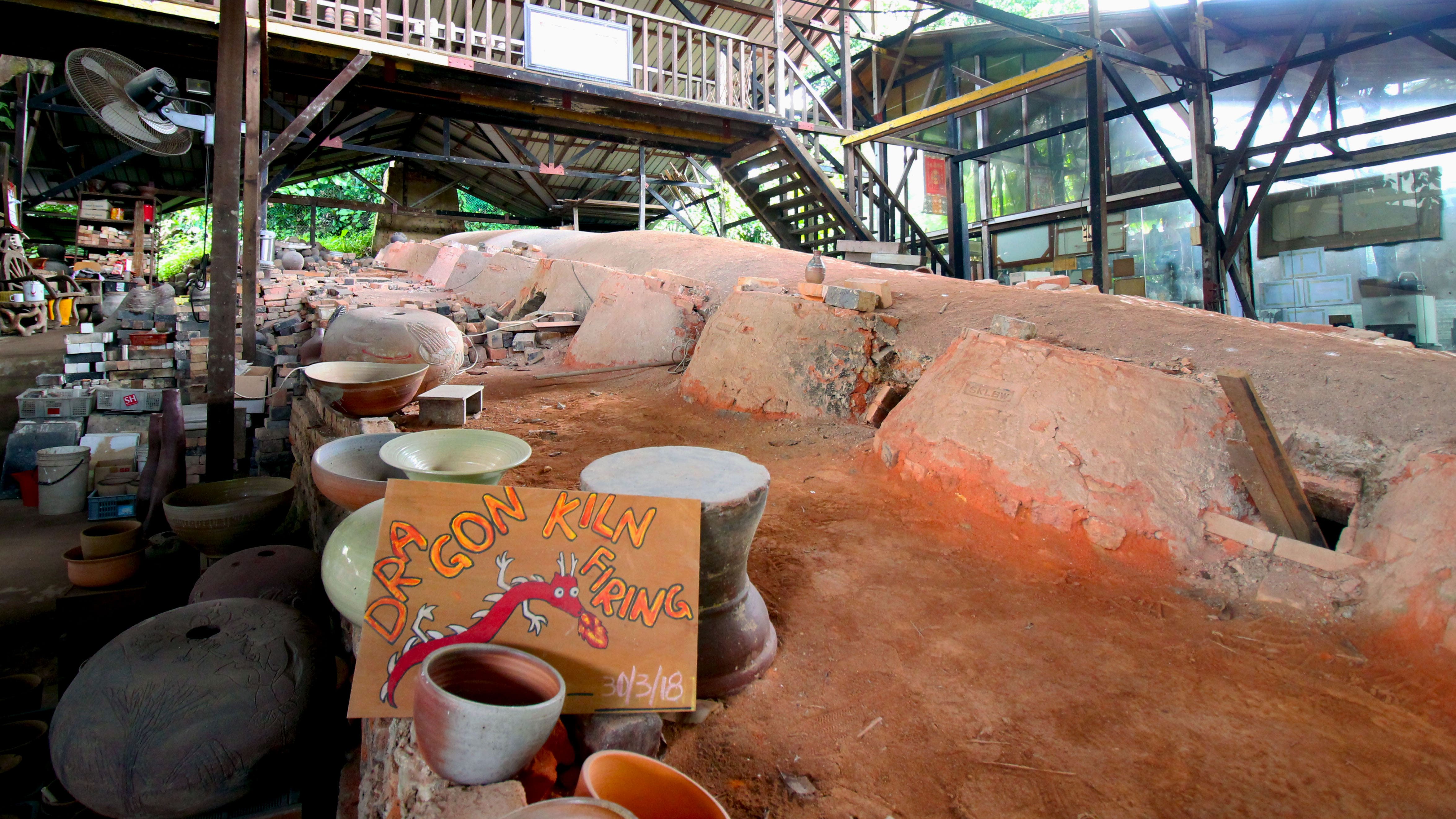 In the western end of Singapore, blissfully sheltered from the bustle of the city, Thow Kwang Pottery Jungle is home to the island’s oldest surviving wood-fired “dragon” kiln, so named for its distinctive, snaking structure. Photo by Lin Yanqin	