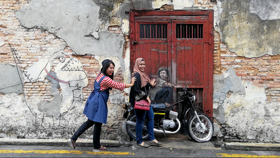 In 2012, Lithuanian artist Ernest Zacharevic was commissioned by the George Town Festival to do a series of public paintings – and the rest is history. Photo by Alexandra Wong