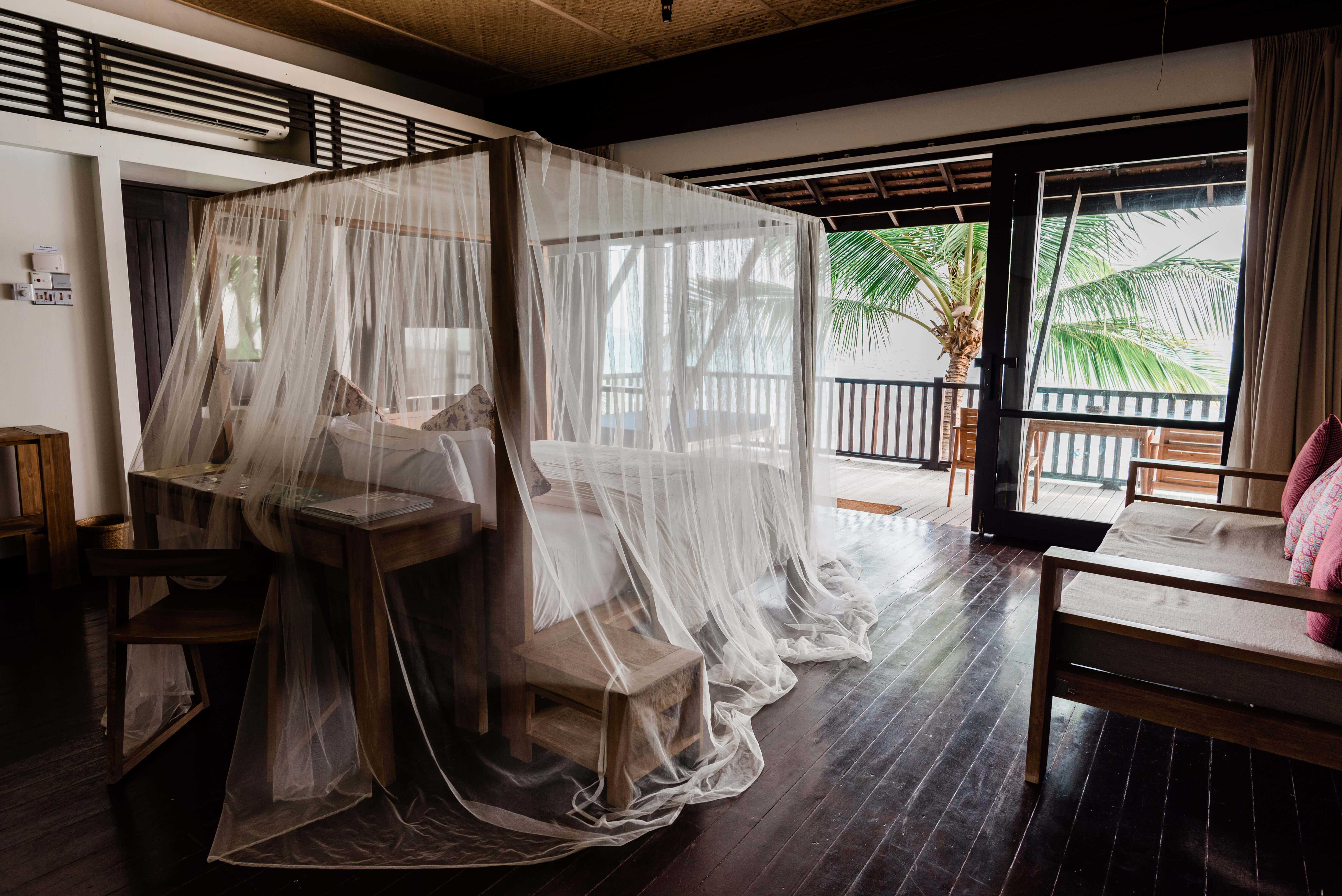 Its eco-friendly practices may challenge guests’ expectations of a high-priced resort. Villas are simply furnished and few disposable amenities, although Malin and Goetz toiletries are provided in large, refillable bottles. Photo by Kenny Ng 