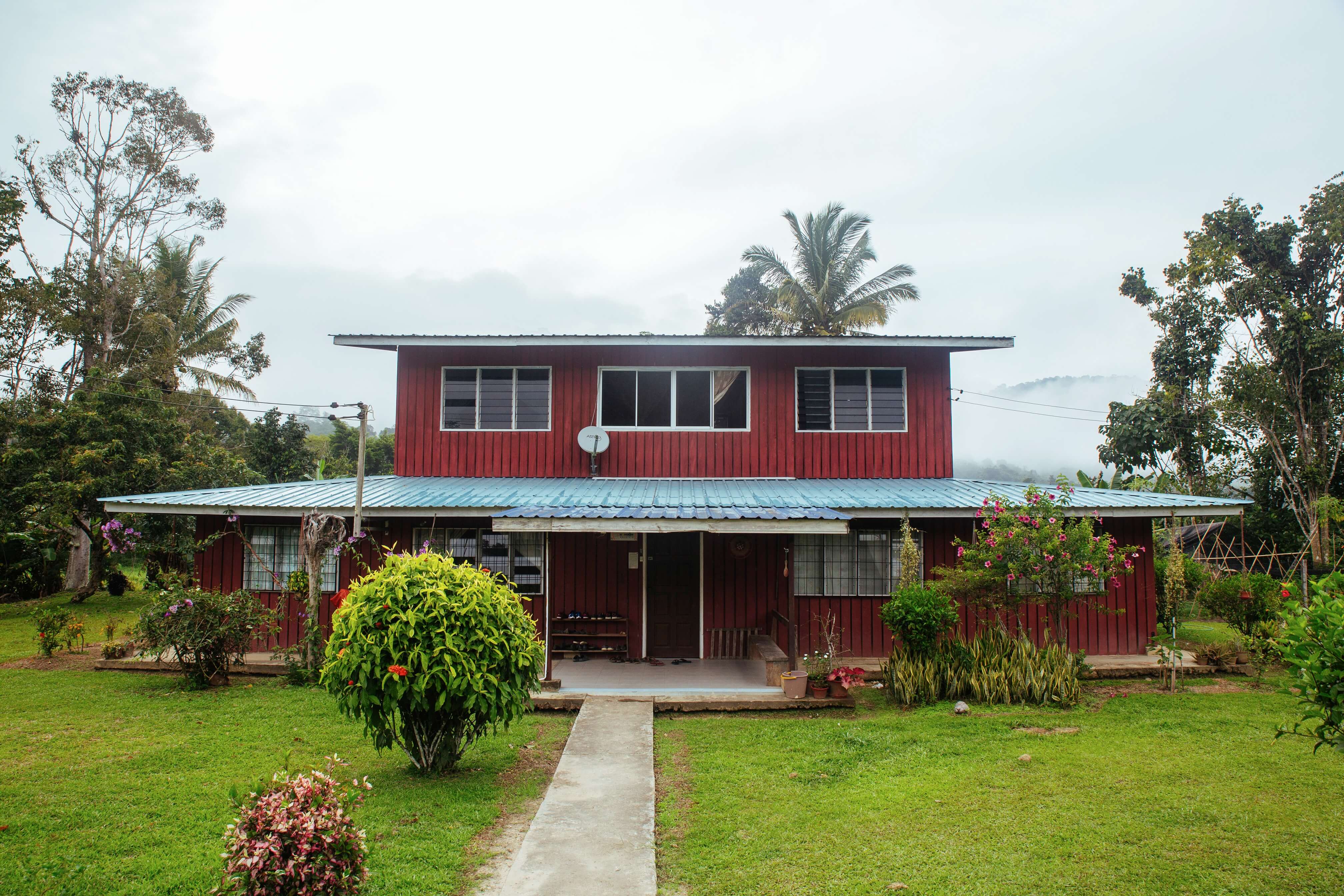 A two-storey house surrounded by a thriving garden, the home of Aunty Ribed, a Lun Bawang rice farmer living in Long Semadoh who has opened up her home for homestays. 