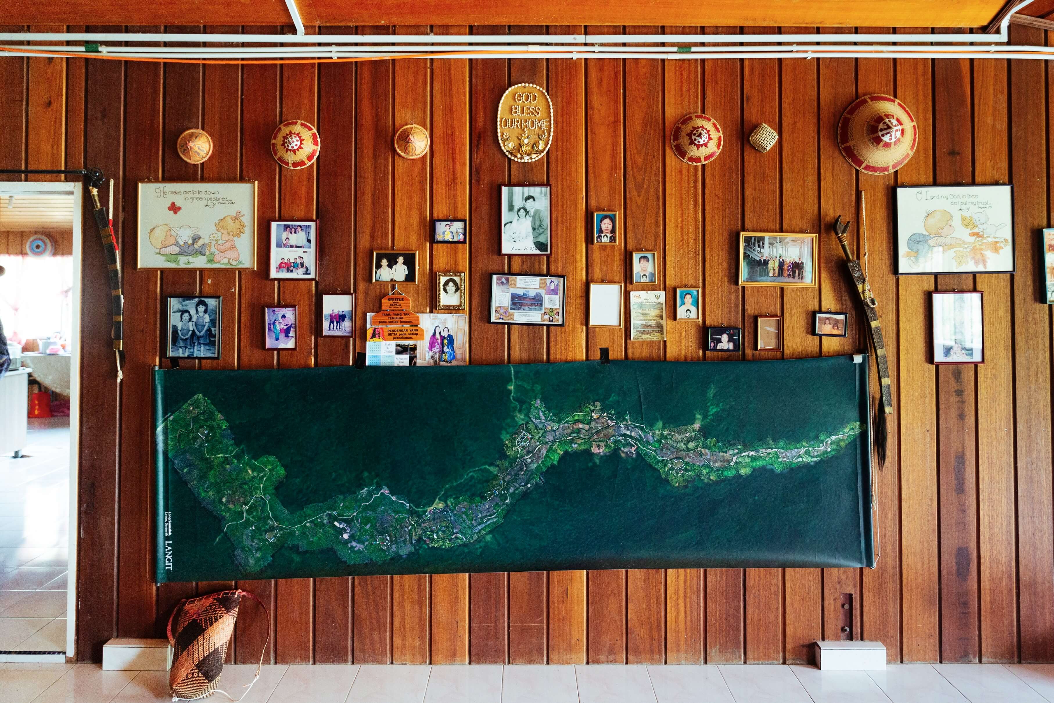 A map of Long Semadoh, displayed with personal photographs and artifacts reflecting local culture. Langit has found success in bringing the Lun Bawang farmers’ rice to a bigger market. Through travel, they hope to bridge the rural-urban divide.