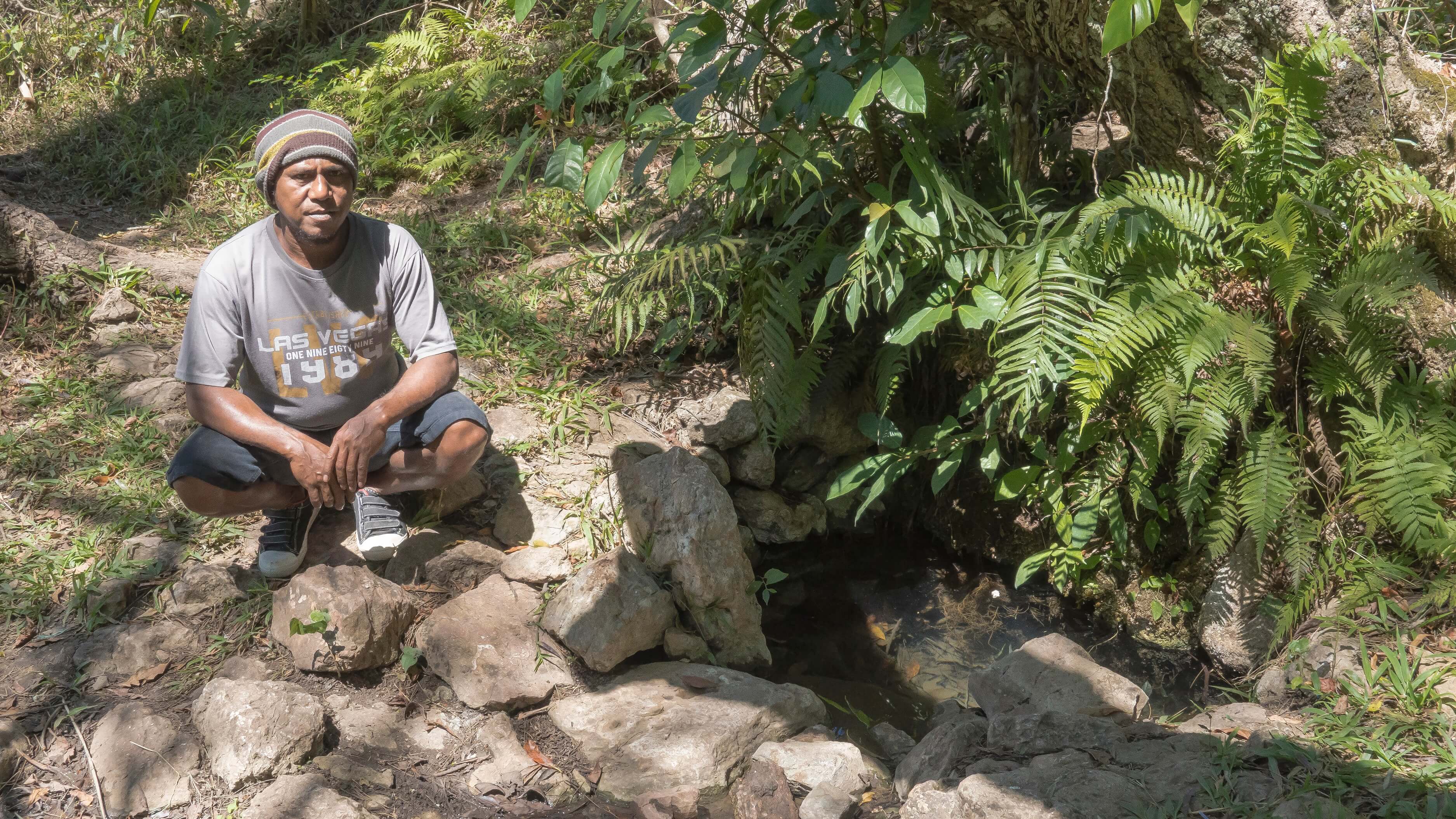 Guide Willybrodus Oematan introducing one of the Oematan triple wellsprings in Taiftob. The Oematans are a Timorese clan traditionally designated as guardians of water sources. This wellspring is believed to have been ritually “planted” by Willy’s grandfather. Photo by Andra Fembriarto