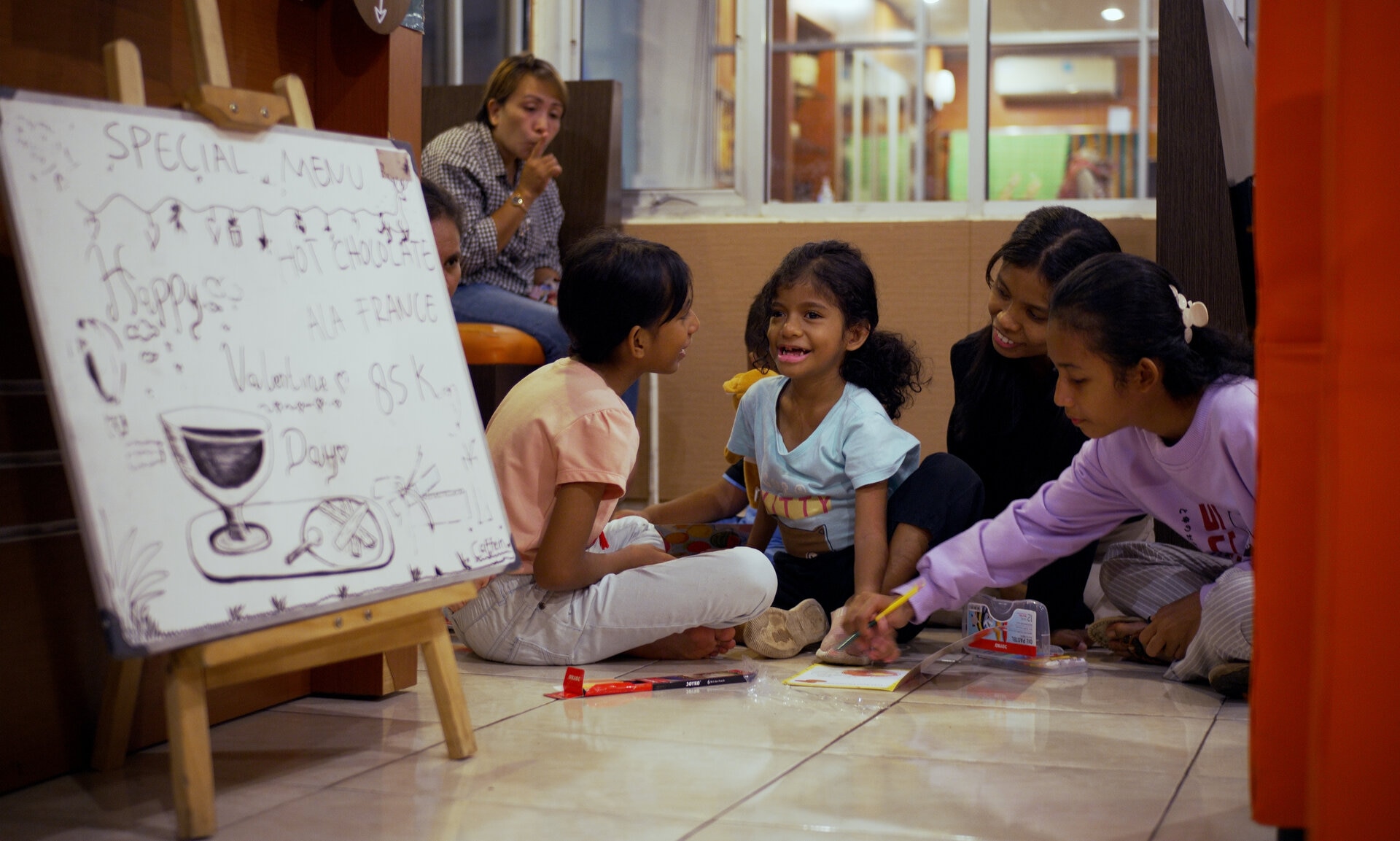 CafeIn hosts weekly playdates for deaf children for educational play and psychosocial stimulation, including learning BISINDO (sign language).