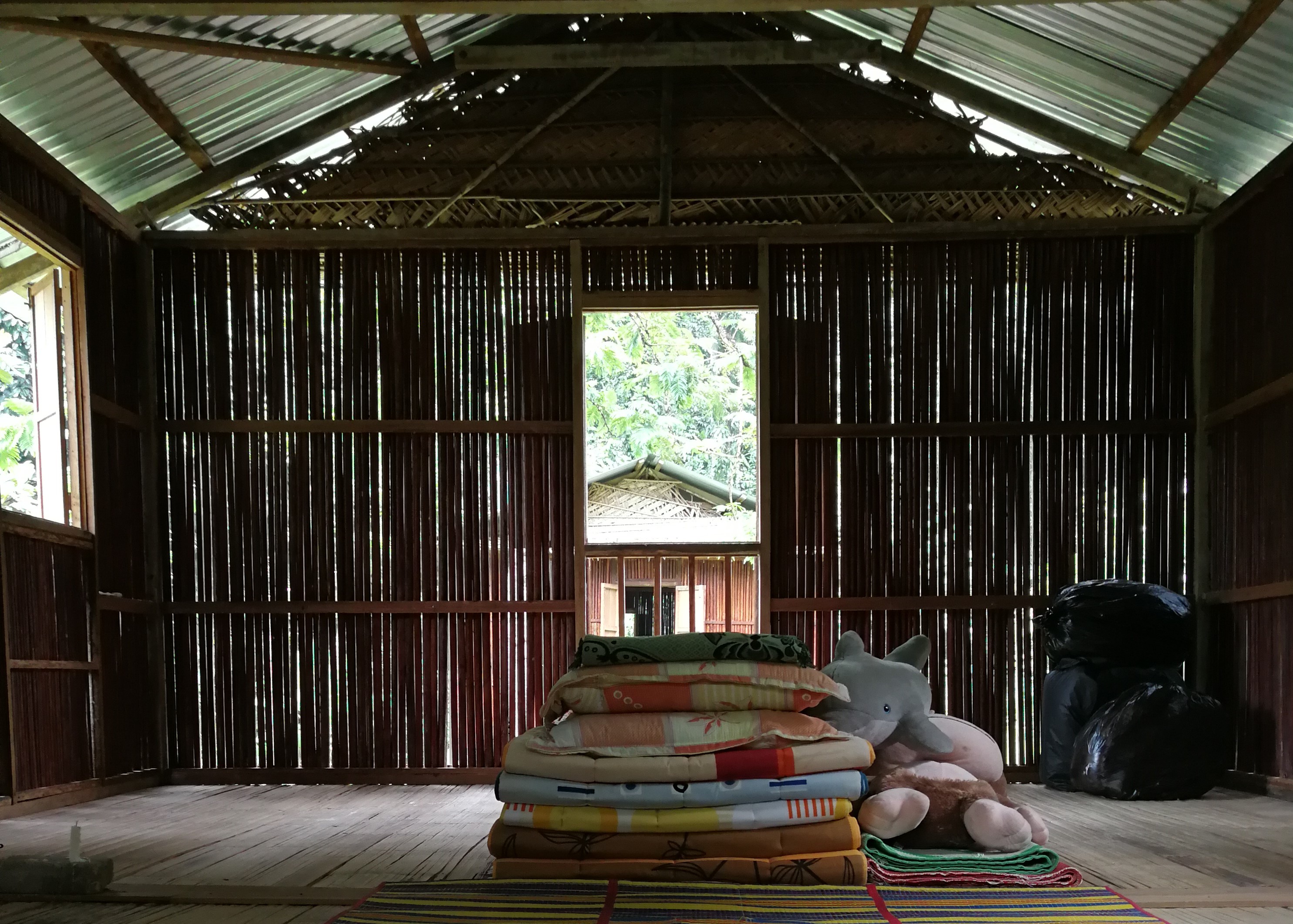 Guests stay in simple but comfortable bamboo chalets built for travellers; those thick blankets come in useful at night when the air turns pleasantly cool.