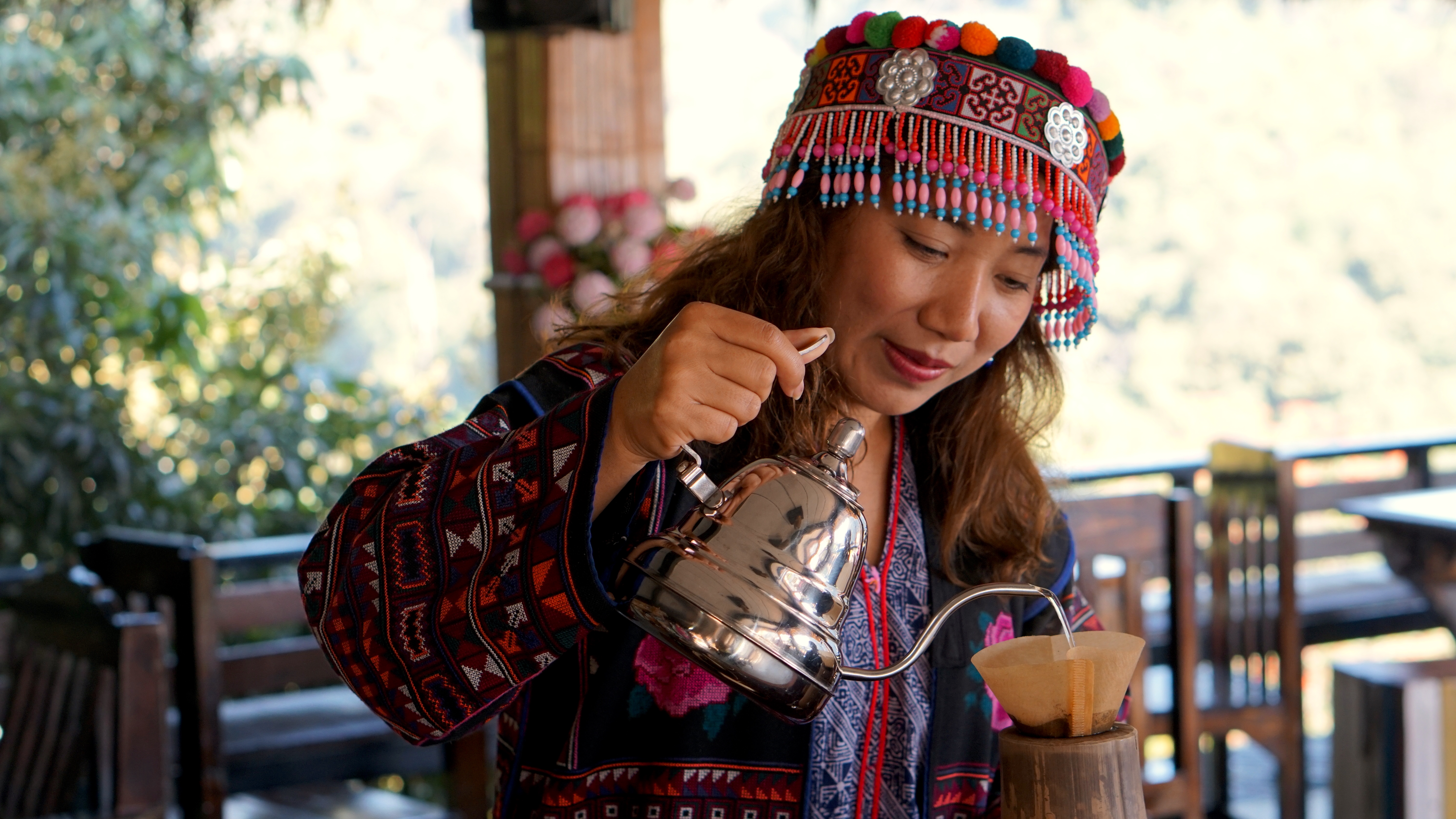 Local tourism leaders like Maew (pictured), are determined to preserve the authenticity of their culture, even as they embrace the chance to share their traditions with visitors, and develop sustainable livelihoods for the community.