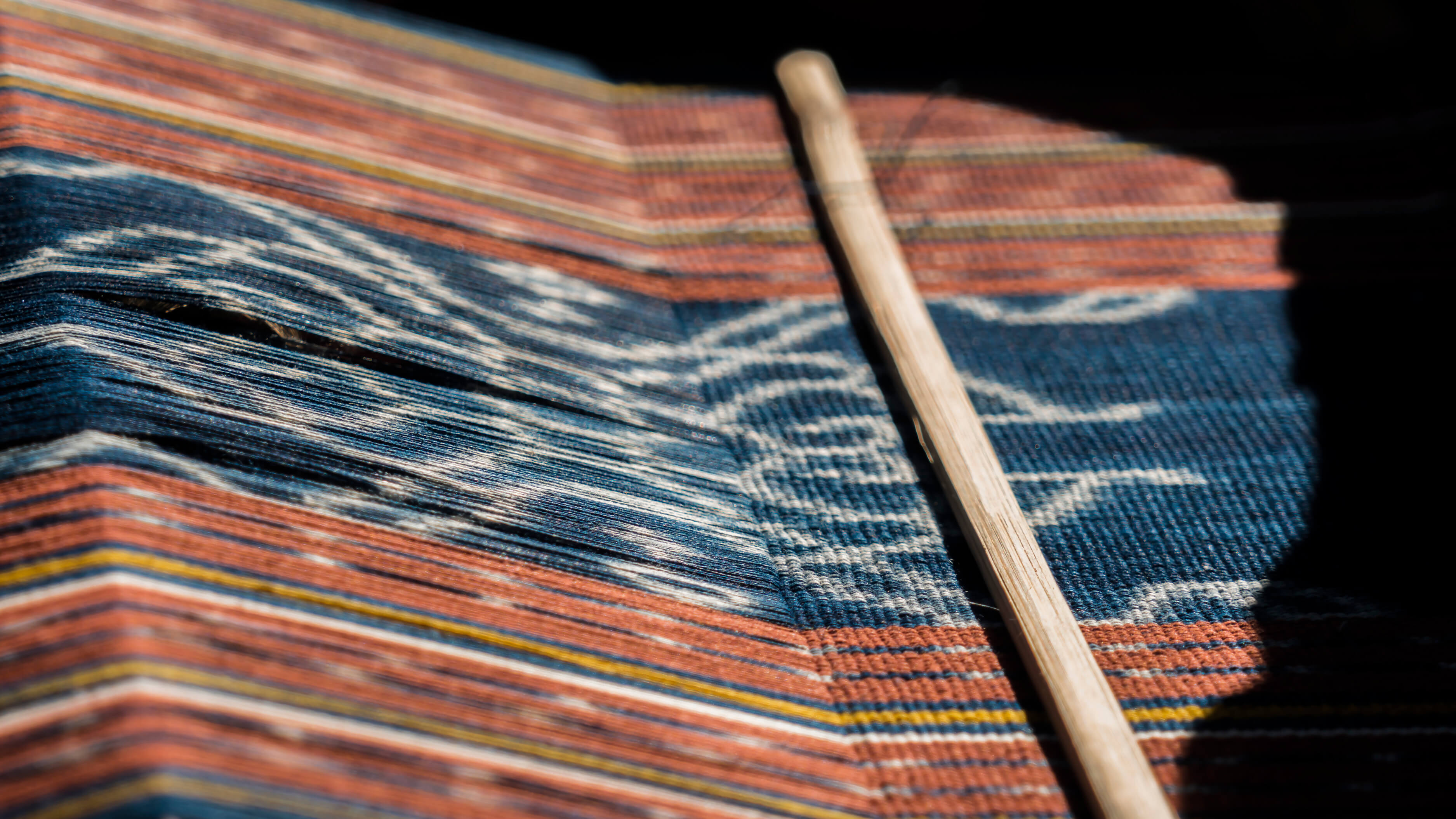 Close up of weft weaving on loom