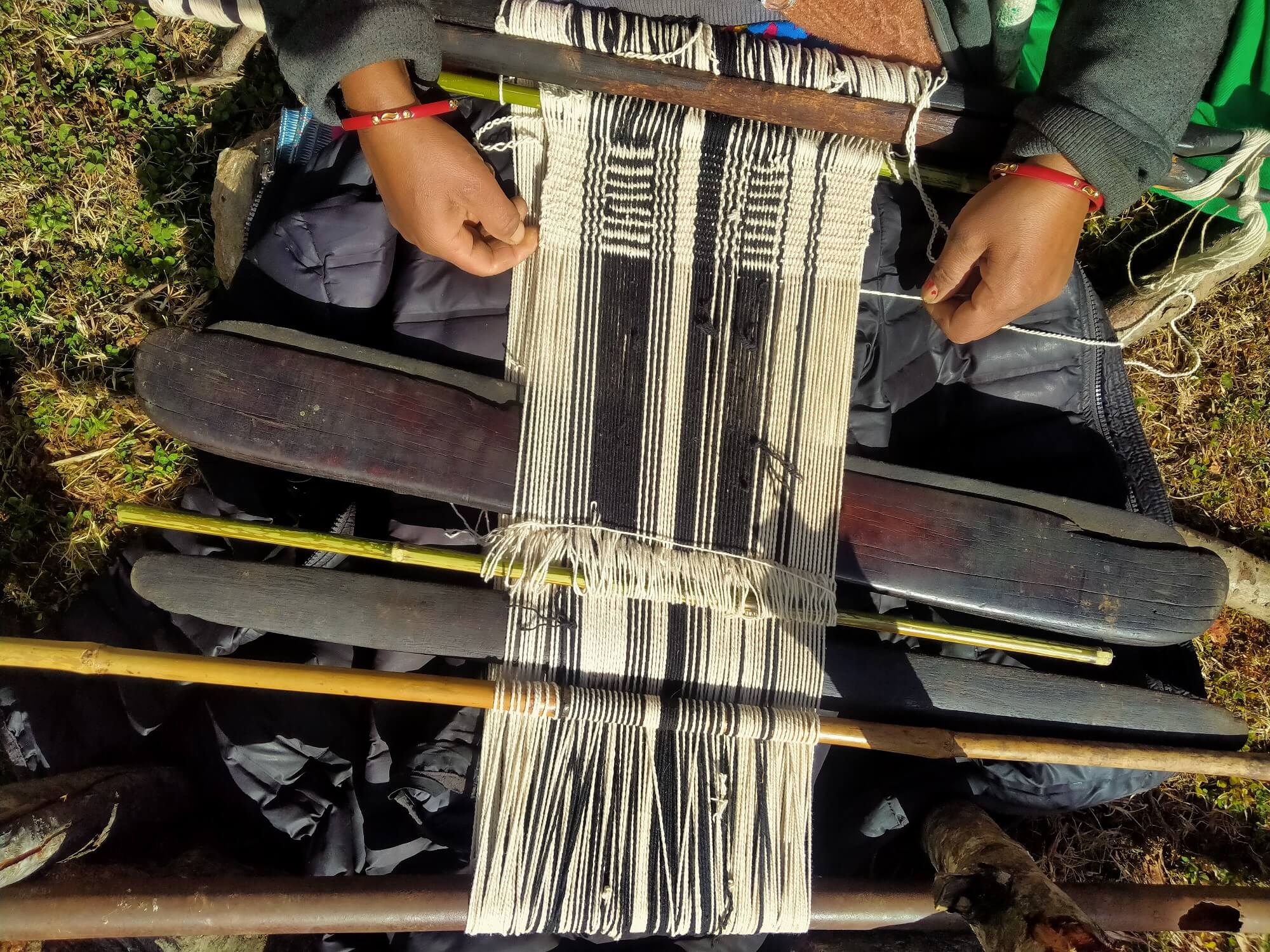 For example, the backstrap loom, a simple device made with ropes, sticks and a strap worn around the waist, had fallen out of use, despite its ability to make practical textiles for everyday use. Photo by Bina Nitwal
