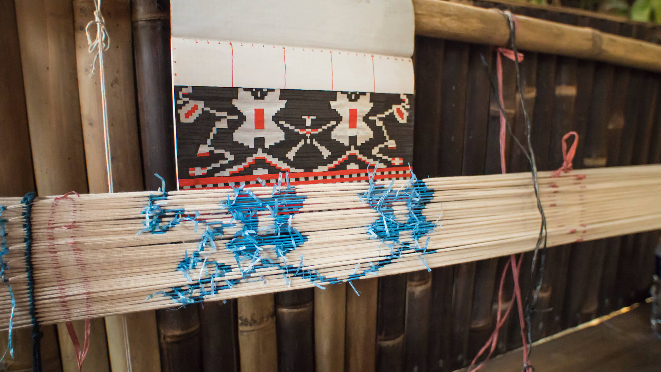 Ikat means “to bind” in Malay and Indonesian. A chosen motif is painstakingly applied through a process known as resist binding, where threads are bound tightly in a wrapping. Photo by Andra Fembriarto
