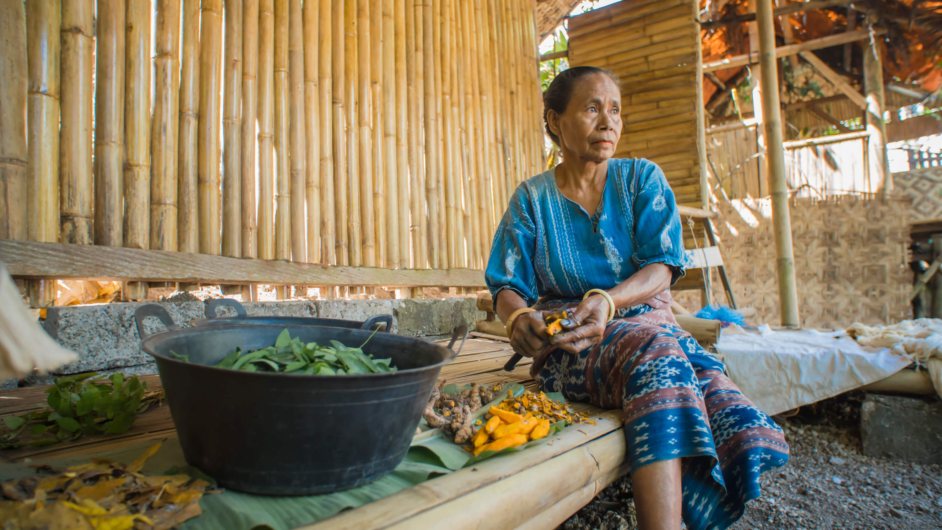 Watubo uses only vegetable dye on their fabrics. This technique is a nod to the community’s ancestral heritage, and it is also less toxic and safer for people and the environment. Here, Maria Roslina prepares turmeric to make yellow dye. Photo by Andra Fembriarto