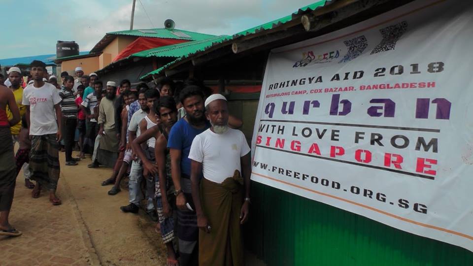 Hundreds of displaced Rohingya men and women queue up at refugee camps in Bangladesh to receive food aid distributed by Free Food for All