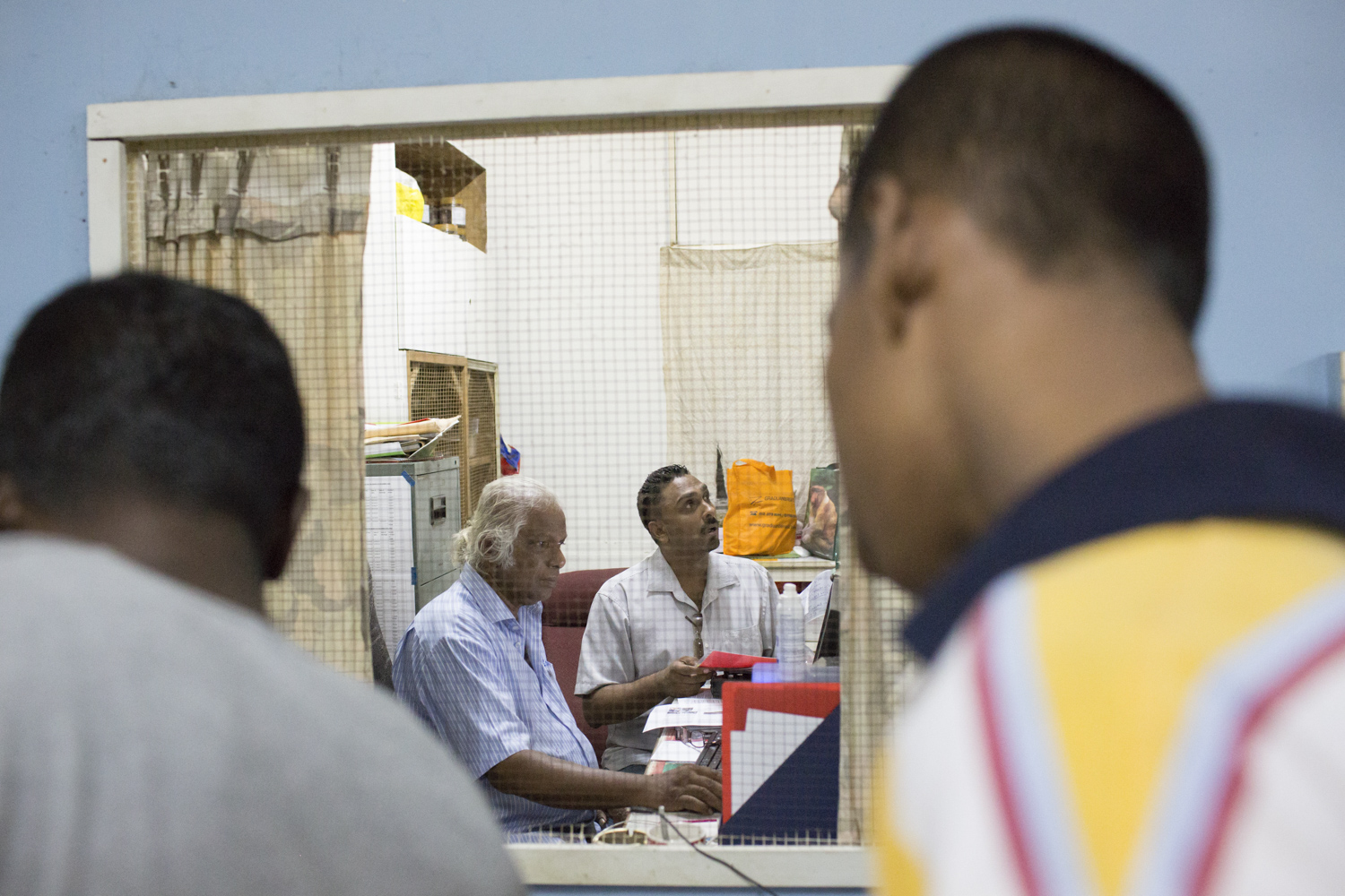 Alex Arokiam, founder and head of PLC, sits with his assistant, Jon, in the office to discuss details of a resident’s case at the sick bay. Alex Arokiam, founder and head of PLC, sits with his assistant, Jon, in the office to discuss details of a resident’s case at the sick bay.