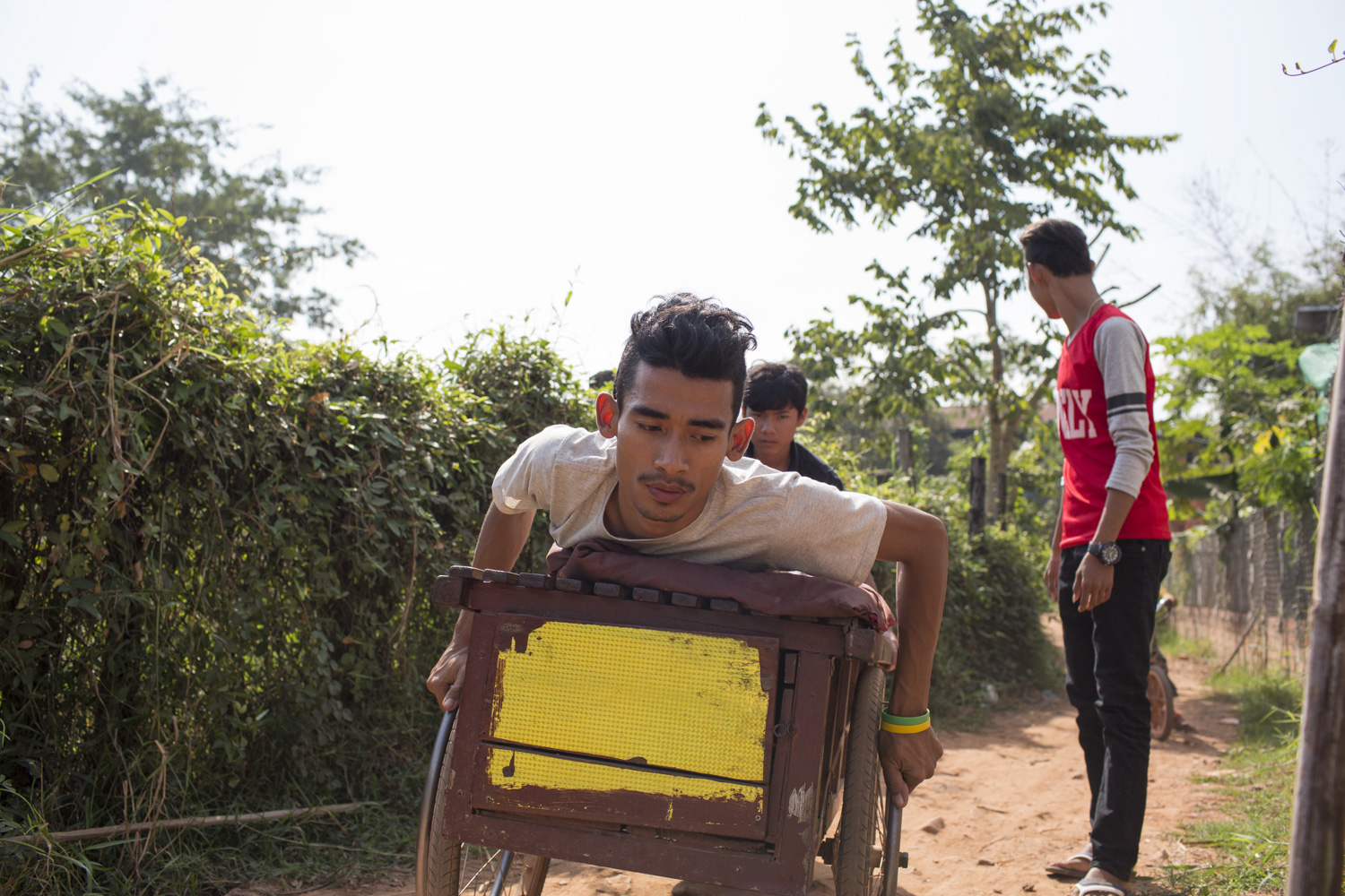 Brak Sophanna lost use of his legs when he was 10 years old. Despite his disability, he is a talented musician, and wants to inspire others through his music. He moves around with a customised wheelcart, which he treats as an extension of his body.