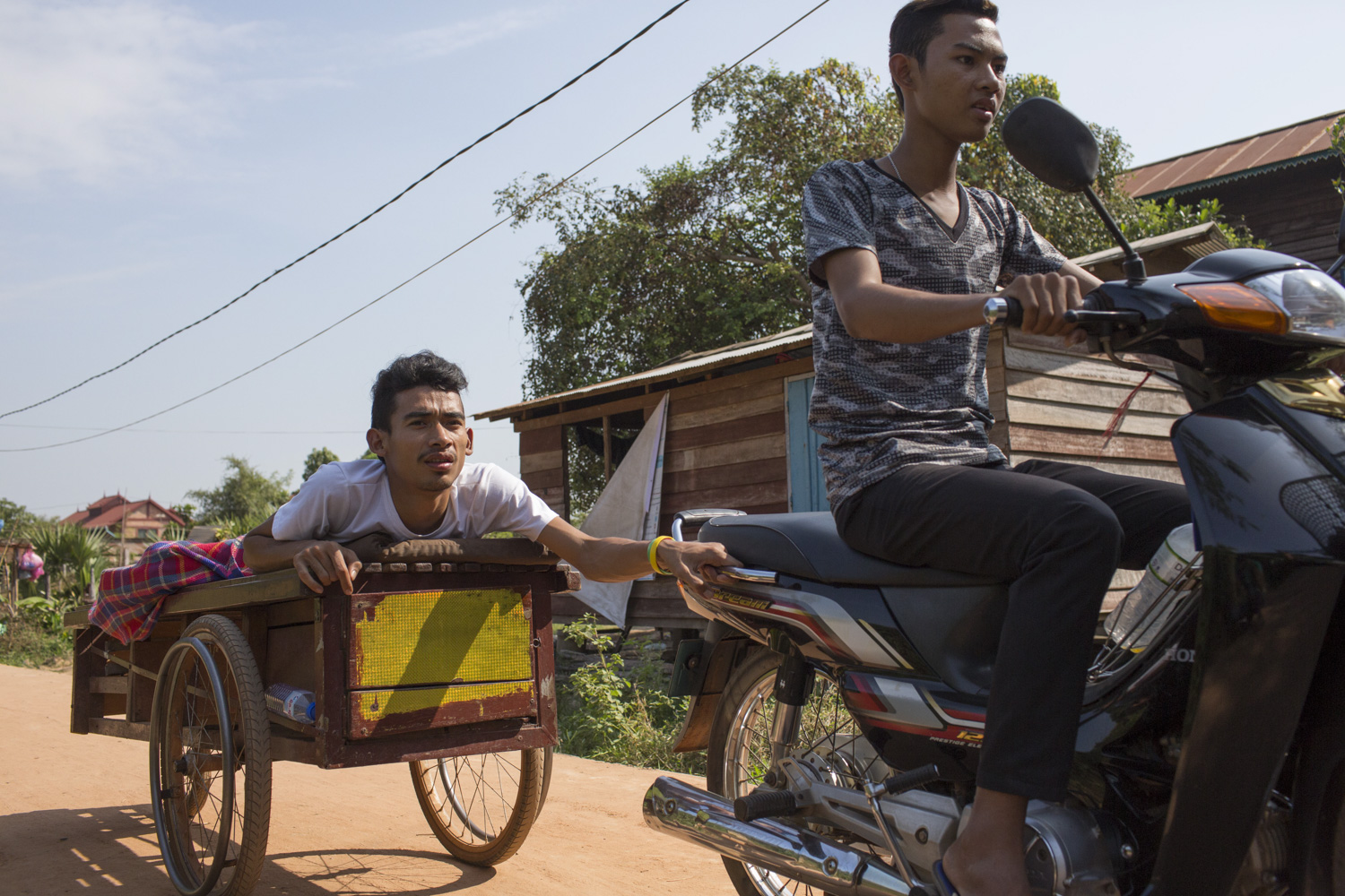 Sophanna now lives with his close friend, Davit, whom he sees as his brother. Davit cares for him daily, and chauffeurs him around with his motorbike wherever he needs. Sophanna now lives with his close friend, Davit, whom he sees as his brother. Davit cares for him daily, and chauffeurs him around with his motorbike wherever he needs.