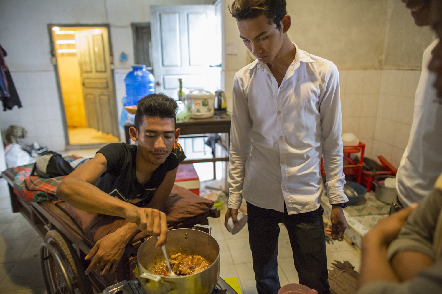 Sophanna enjoys cooking, and helps prepare meals for his housemates at the music school. Davit watches Sophanna and tries to learn a tip or two. Sophanna enjoys cooking, and helps prepare meals for his housemates at the music school. Davit watches Sophanna and tries to learn a tip or two.