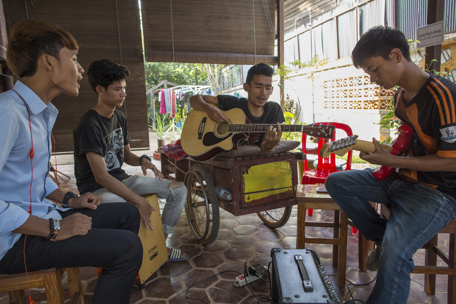 Sophanna rehearsing popular Khmer songs with his band before their performance.