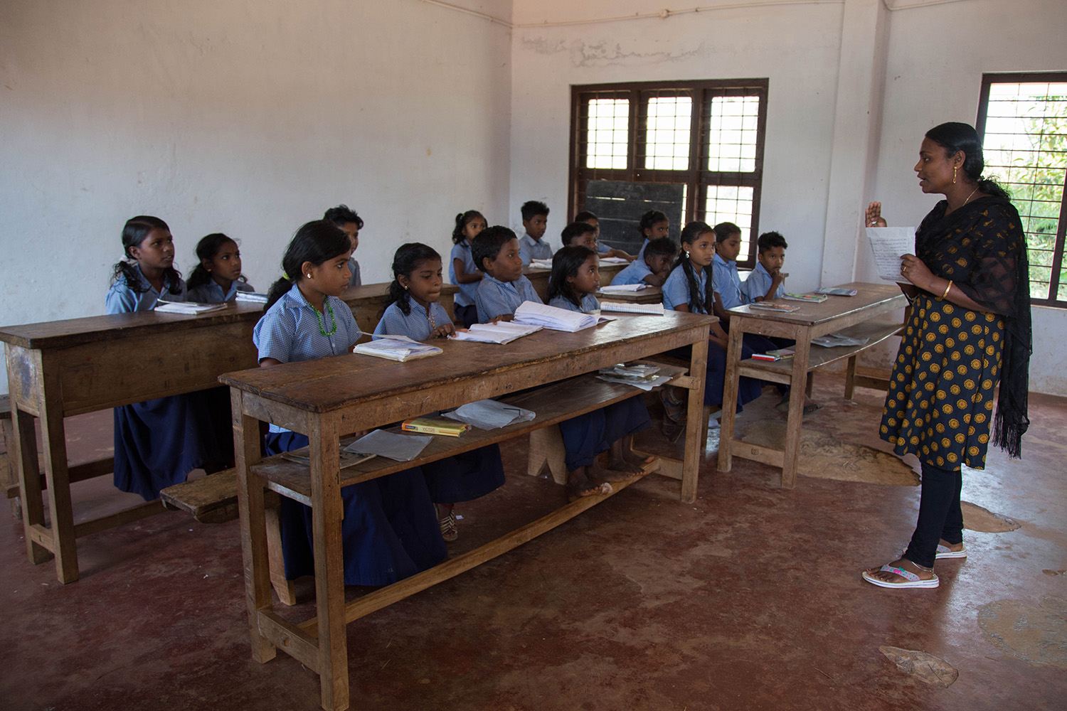 Education is free. The students are given books, pens, food, accommodation, and medical care. The classrooms are very simple, consisting of a few wooden benches and a blackboard.