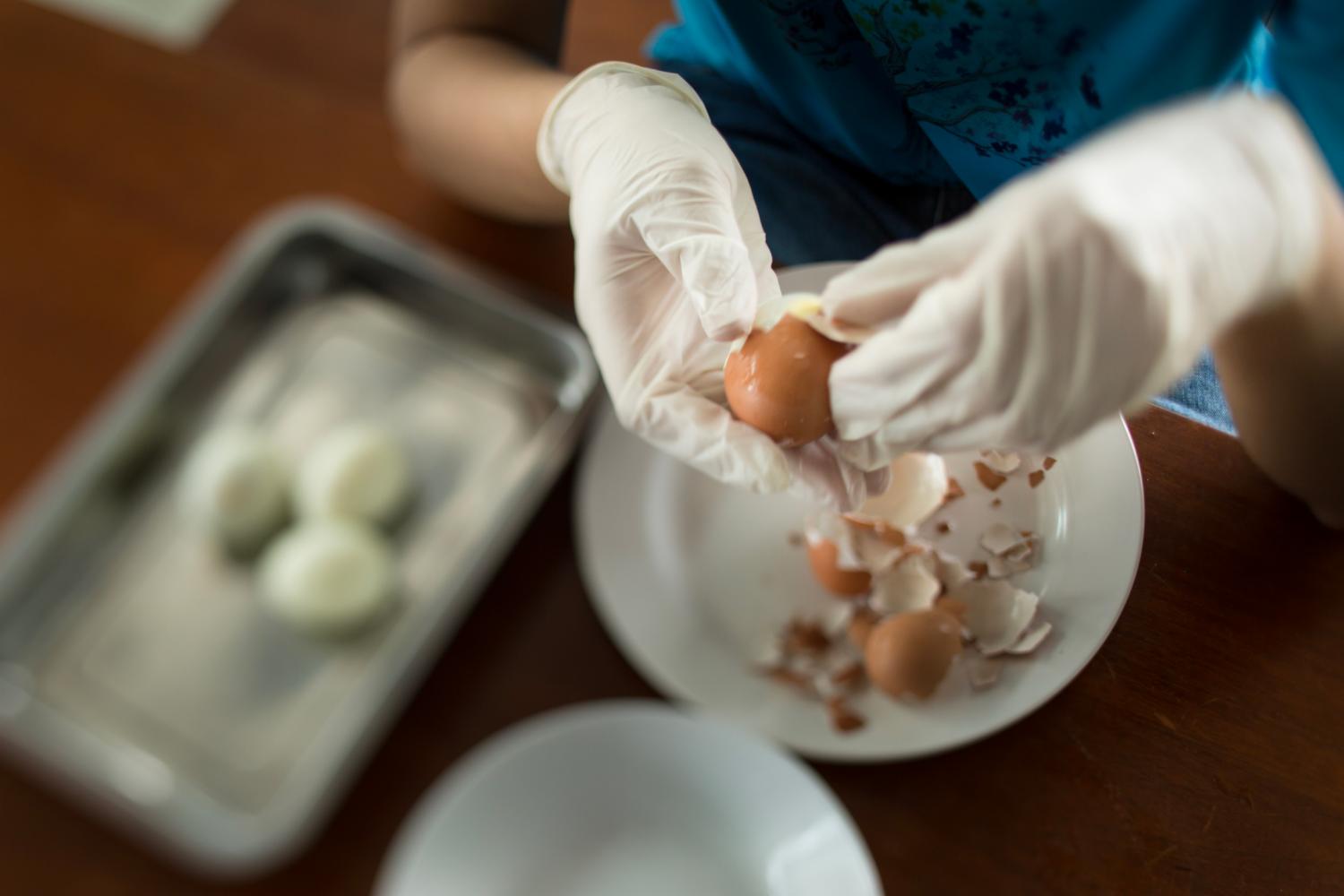 For Luqman, tasks like washing the rice and peeling eggs help to develop his fine motor skills. After six months, Luqman is now able to pack nasi lemak without assistance.