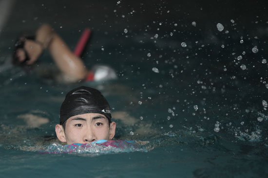 Lapping it up: The swimmers train six days a week from 9am to noon, and again from 2pm - 5pm. Some days they swim up to 8km, or 160 laps of an Olympic-size swimming pool