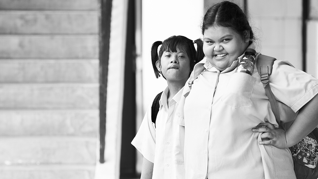 These two young ladies were inseparable most of the time. This is a picture of an older sister making sure her younger sibling is always taken care of. Just look at that smile!