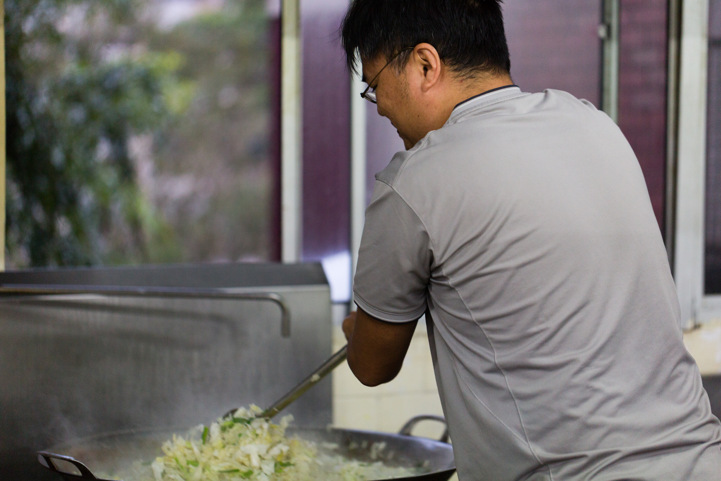 Josh then wields the giant spatula, cooking kilogram after kilogram of greens Josh then wields the giant spatula, cooking kilogram after kilogram of greens