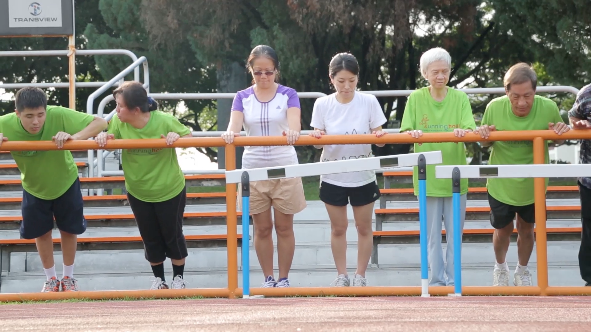 Participants at Runninghour warming up before a run 