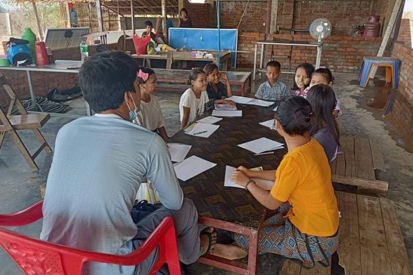 Joseph quizzing young minds at a GVH foster home to assess candidates for their bursary fund. Photo courtesy of GVH.