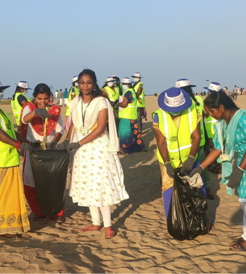 Picking litter along the beach 