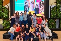 A group of smiley people taking a photo