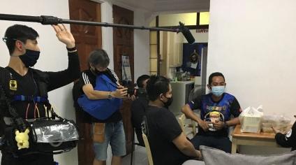 Camera men filming behind the scene of a video