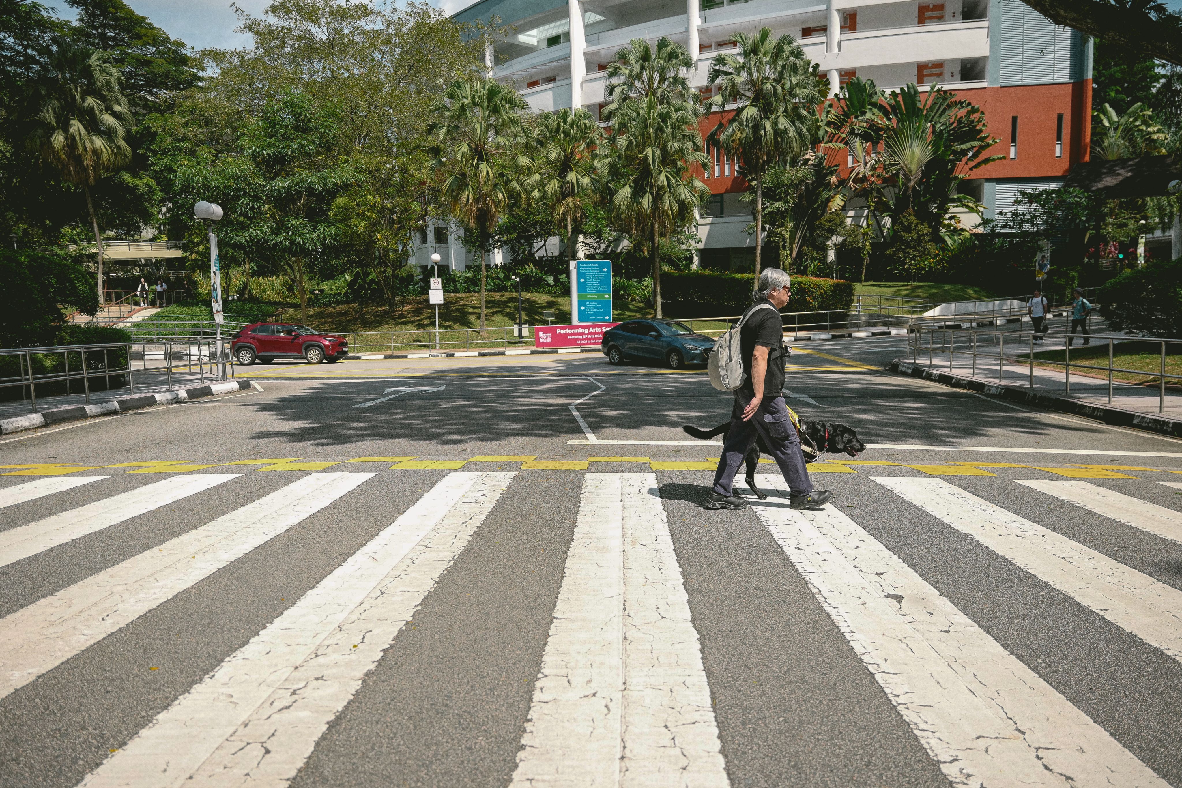 Guide Dogs Singapore beneficiary Gary Lim and his guide dog Matt.