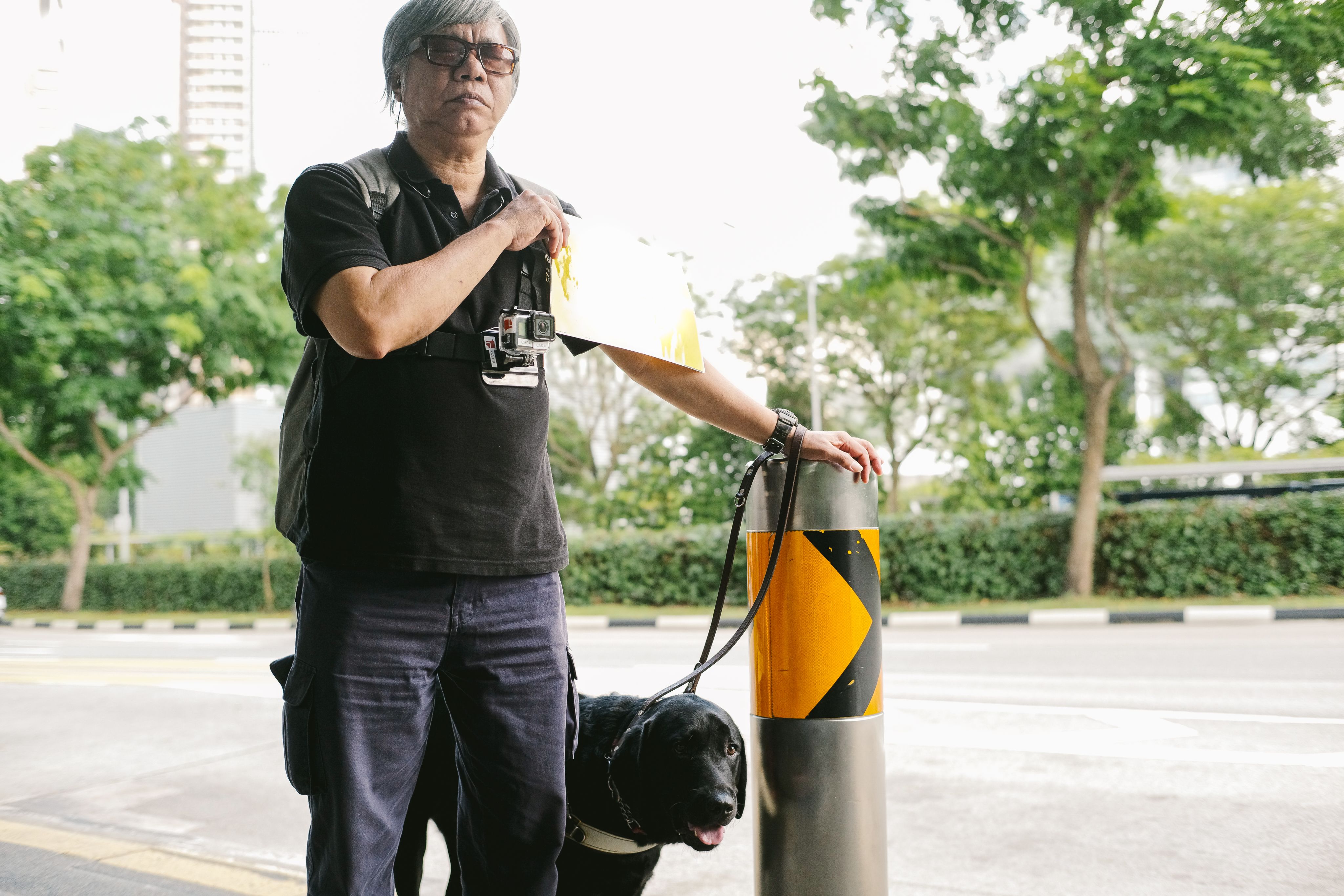 Gary Lim signals a public bus on his regular commute.