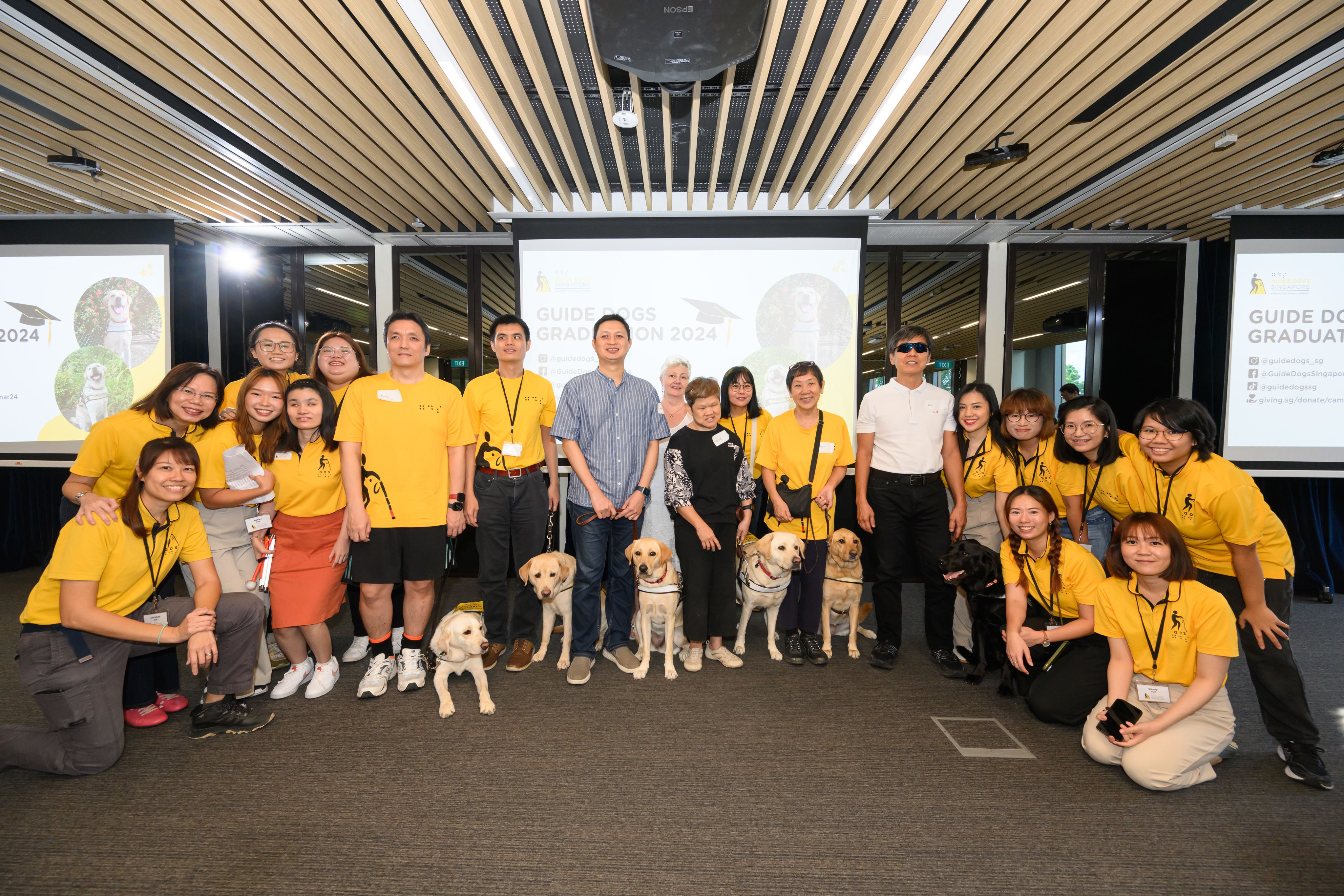 Guide dog teams that have graduated from Guide Dogs Singapore's programme.  