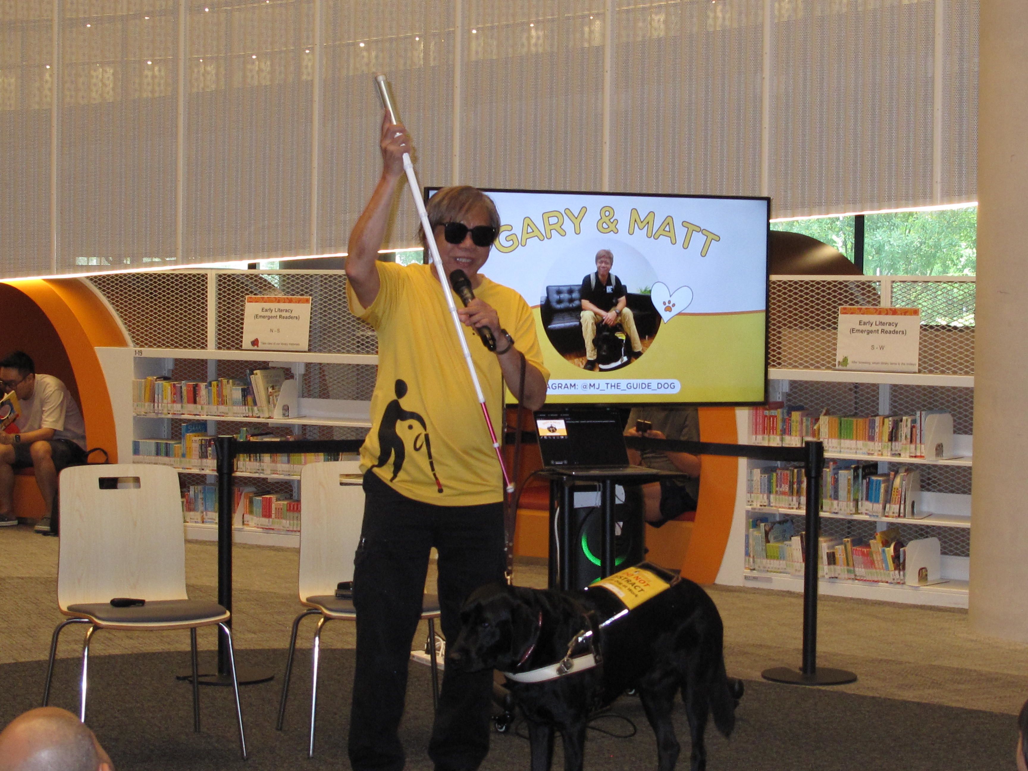 Gary Lim helps to spread awareness of guide dog users and their needs by giving public talks. 