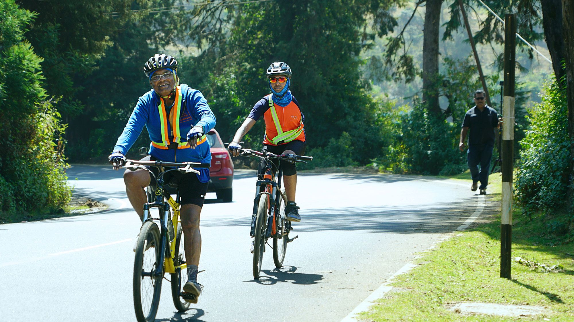 A man and woman on a yellow boat with their two children, by the beach in the Philippines. 