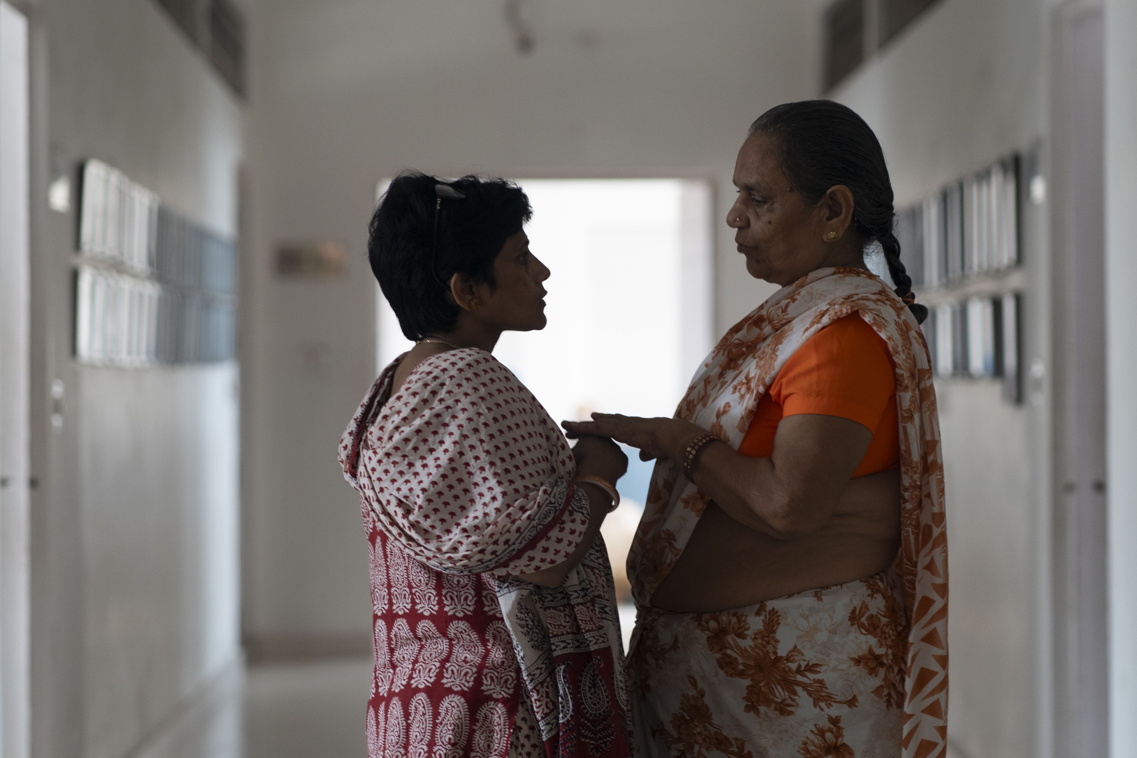 Bijauli Modi Maiya (right) receives care and moral support from Maitri's staff members.
