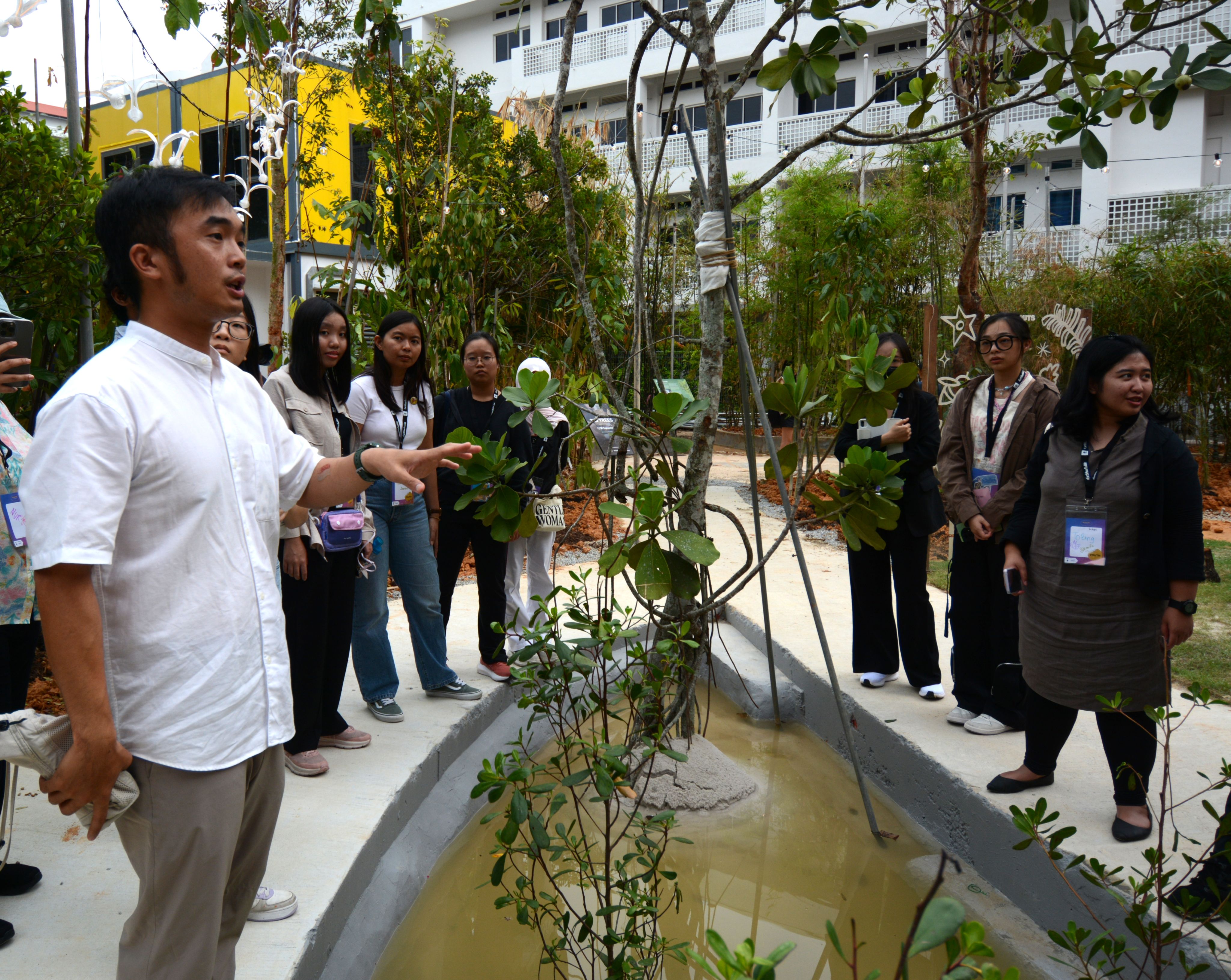 Zac Toh, CEO and co-founder of Vidacity, leads a tour around the mini-forest.